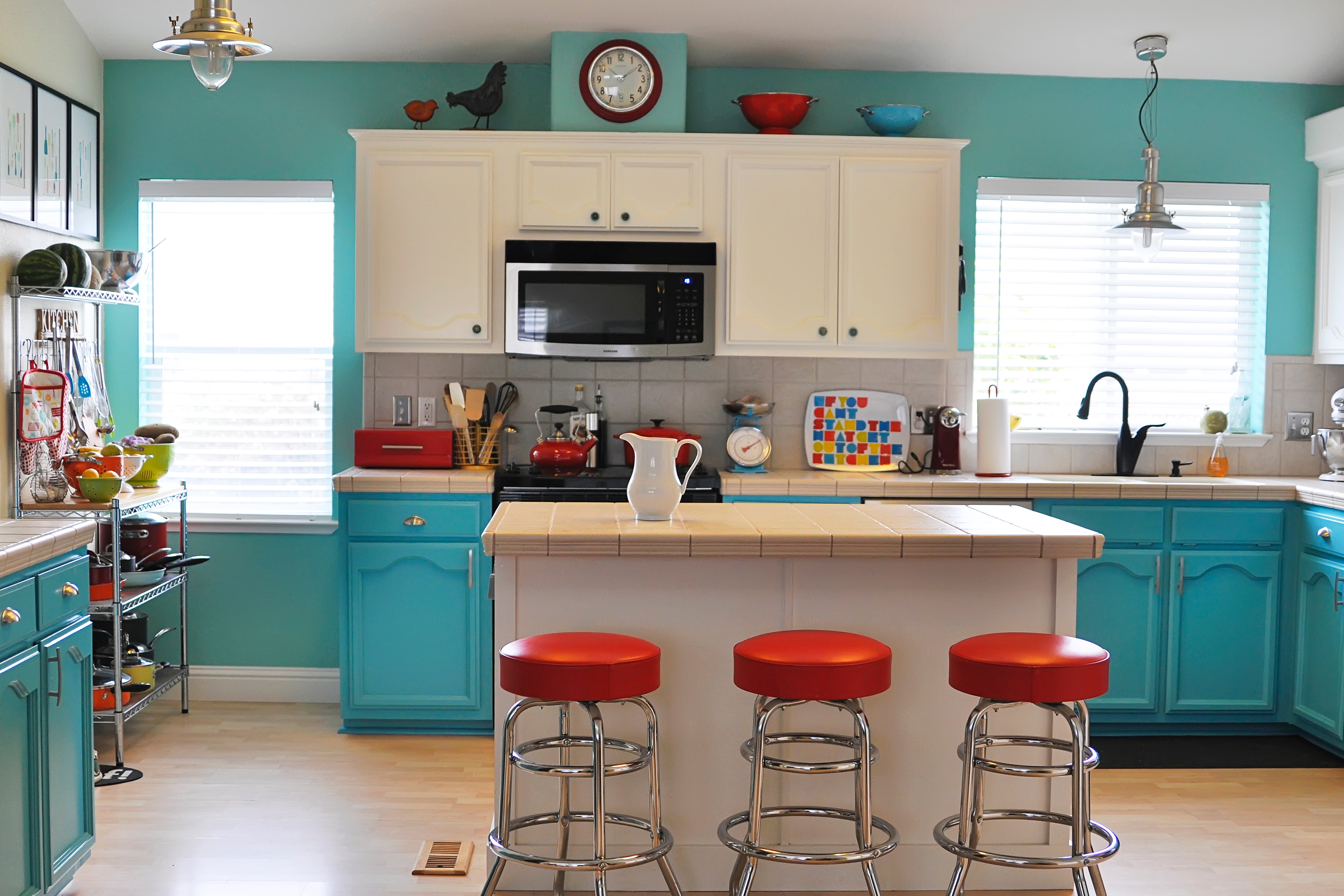 Colorfully painted kitchen with white cabinets
